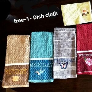 A towel set, 7 kitchen Towels with the days on and 1 free dish cloth